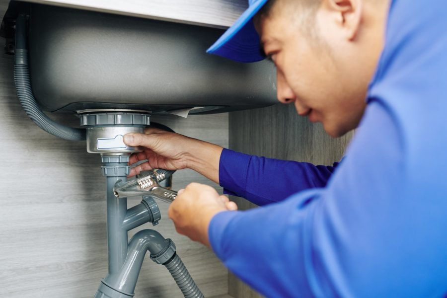 plumber-repairing-a-leaky-drain.jpg